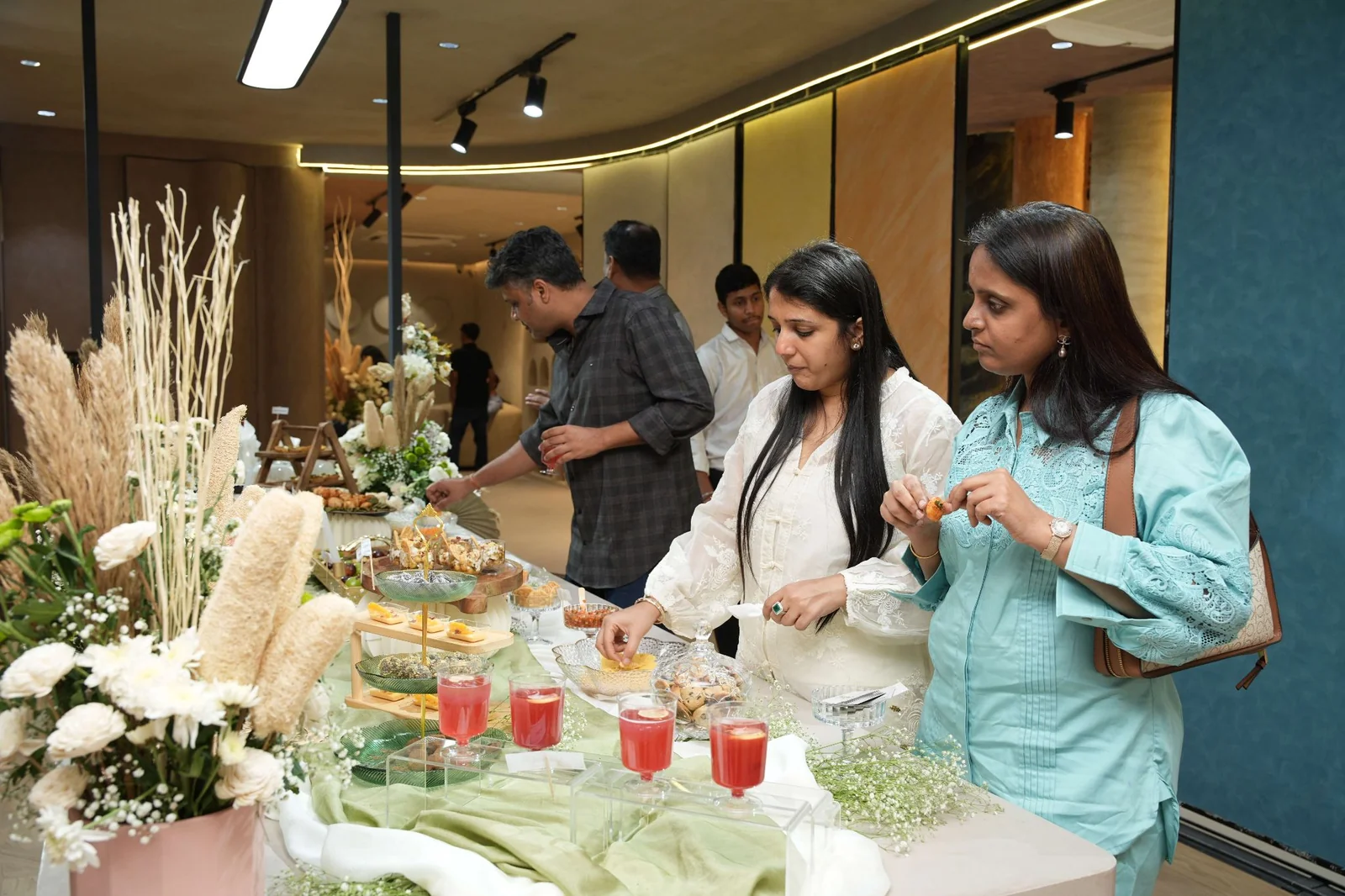 Guests selecting bites from the grazing table at the Soul Studio launch.